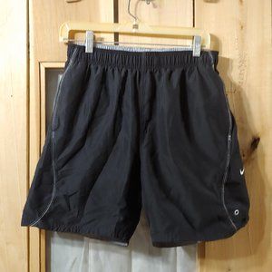 NIKE   mans swim trunks  7" size small